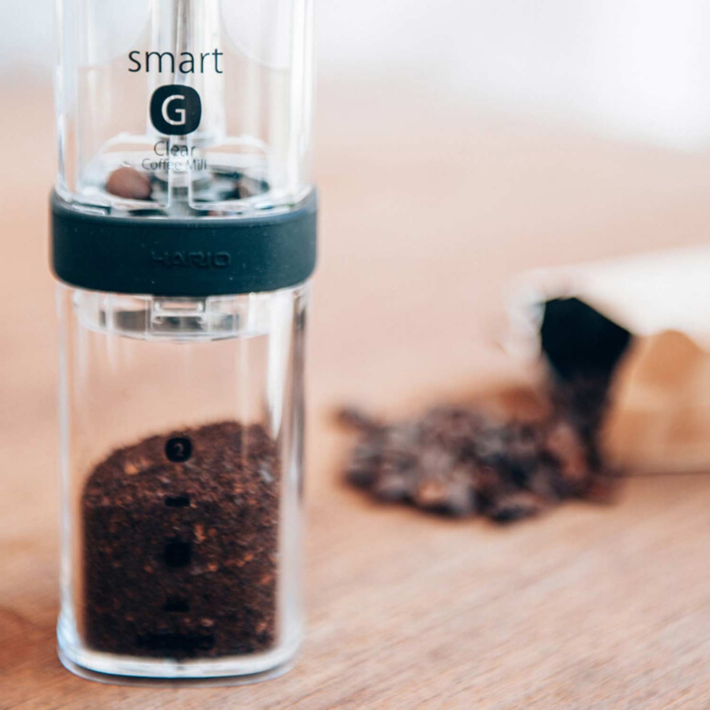 Hario Coffee Mill Smart G Hand Grinder | Transparent With Ground Coffee
