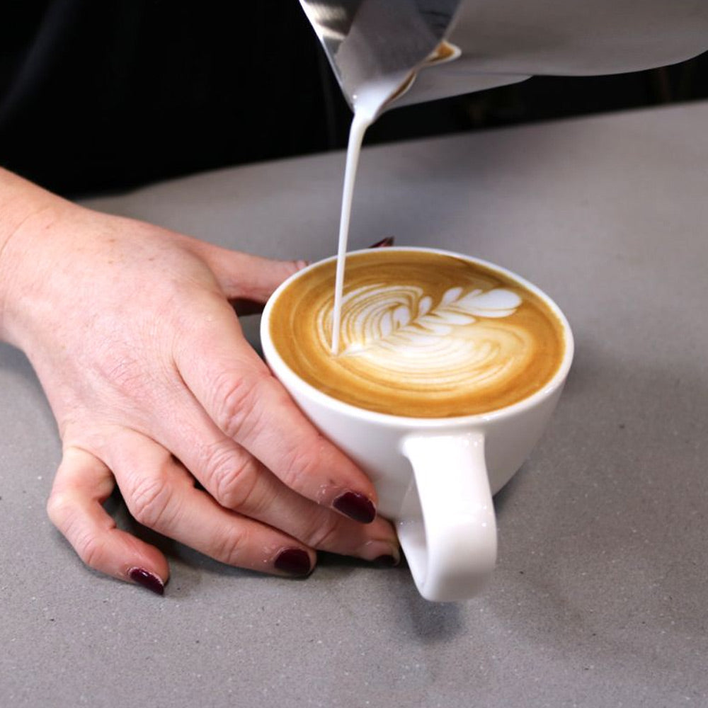 Rhino Classic Milk frothing jug pouring flat white