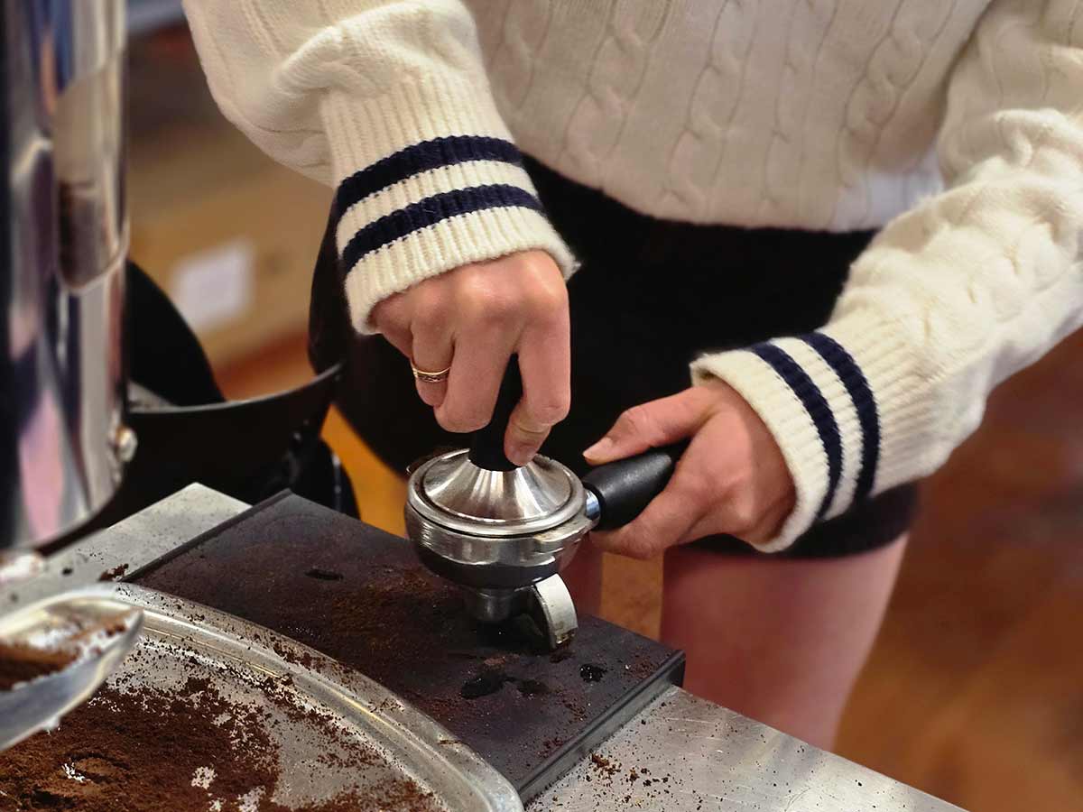 learning how to use an espresso tamper making coffee